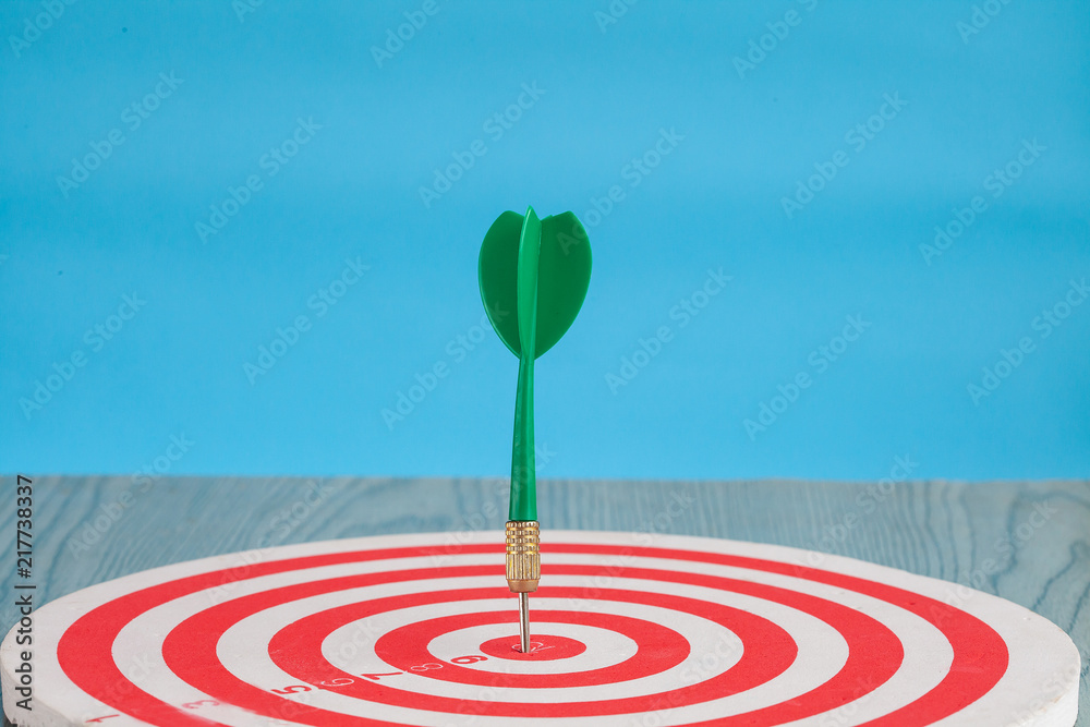 Dart arrow on target dartboard ,Business success concept. Dart arrow on target dartboard ,Business success concept.