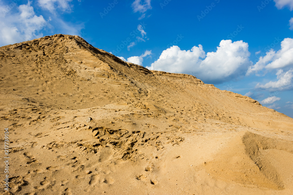 sand dune on the background of cloudy sky