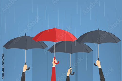 Hand holding umbrellas