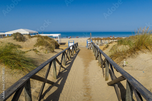 Sand dunes in front of the beach of La Barrosa in Sancti Petri in Chiclana de la Frontera, Spain
