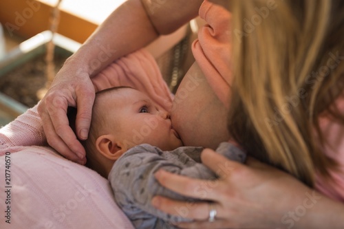 Mother breastfeeding her baby boy
