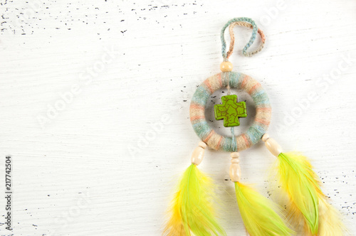 Bright dream catcher with green cross photo