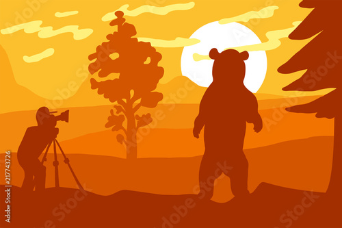 Photographer photographs bear in nature