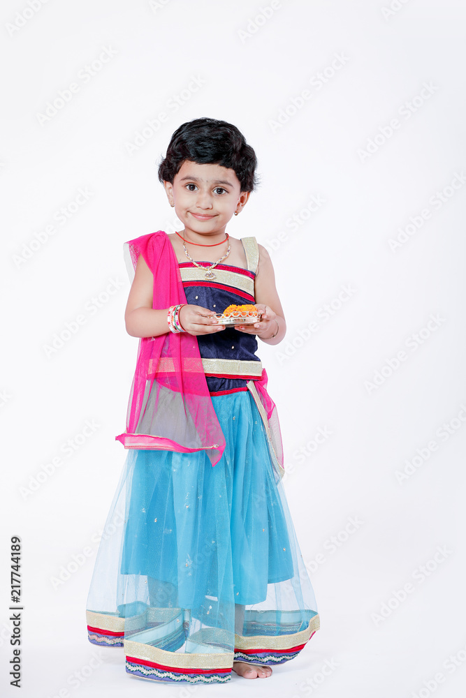 Little Indian girl child with lord ganesha and praying , Indian ganesh festival Little Indian girl child with lord ganesha and praying , Indian ganesh festival