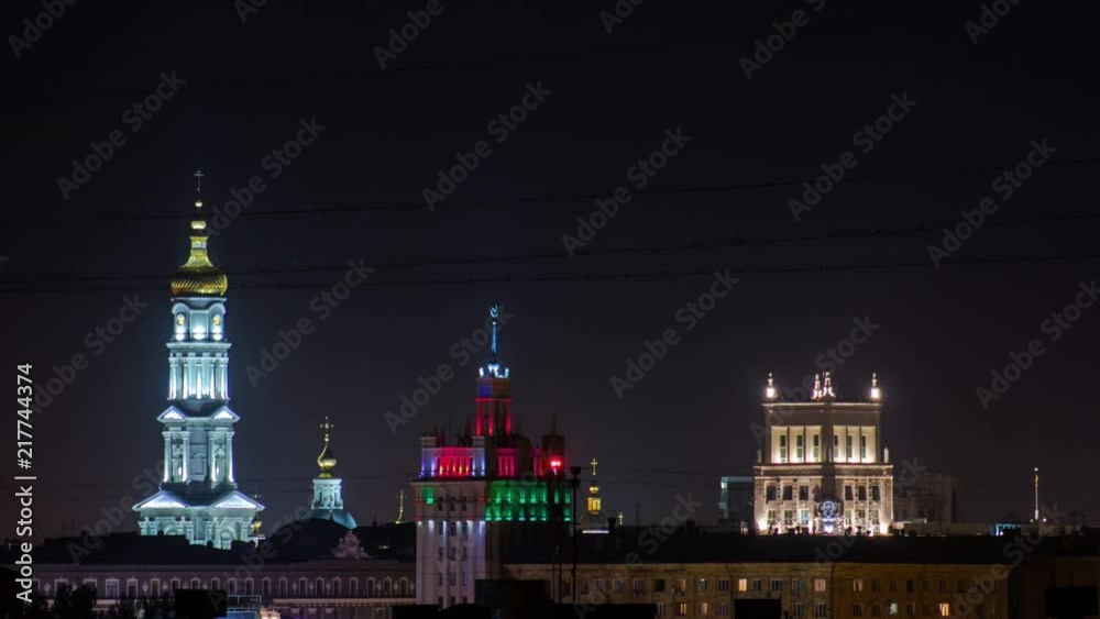 The bell tower of the Assumption Cathedral Uspenskiy Sobor, City council and house with a spire night timelapse in Kharkiv, Ukraine The bell tower of the Assumption Cathedral Uspenskiy Sobor, City council and house with a spire night timelapse in Kharkiv, Ukraine