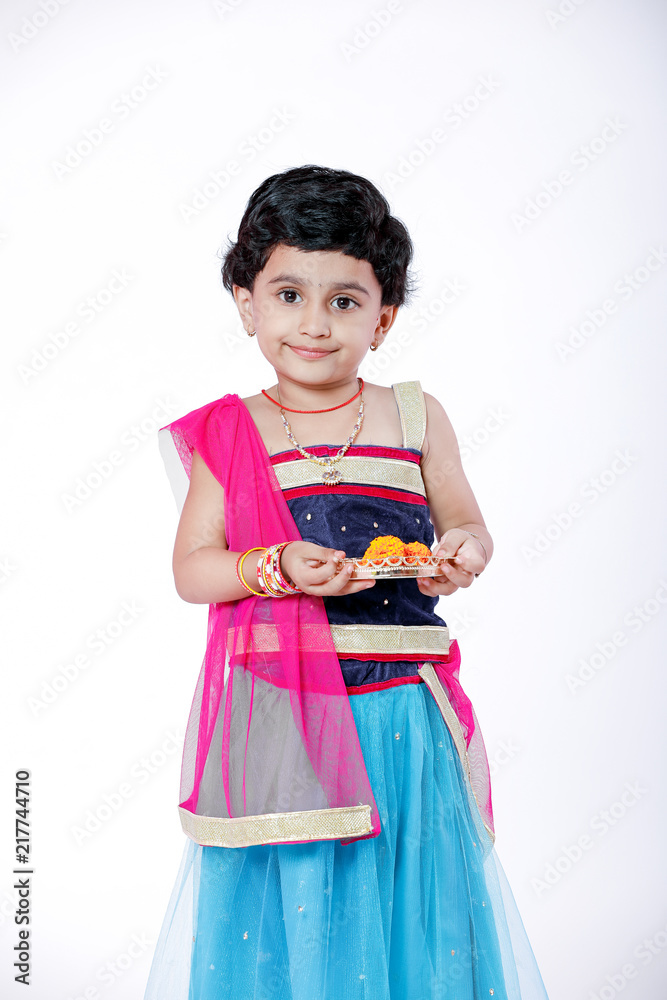 Little Indian girl child with lord ganesha and praying , Indian ganesh festival Little Indian girl child with lord ganesha and praying , Indian ganesh festival
