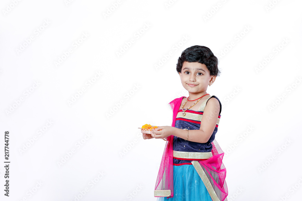 Little Indian girl child with lord ganesha and praying , Indian ganesh festival Little Indian girl child with lord ganesha and praying , Indian ganesh festival