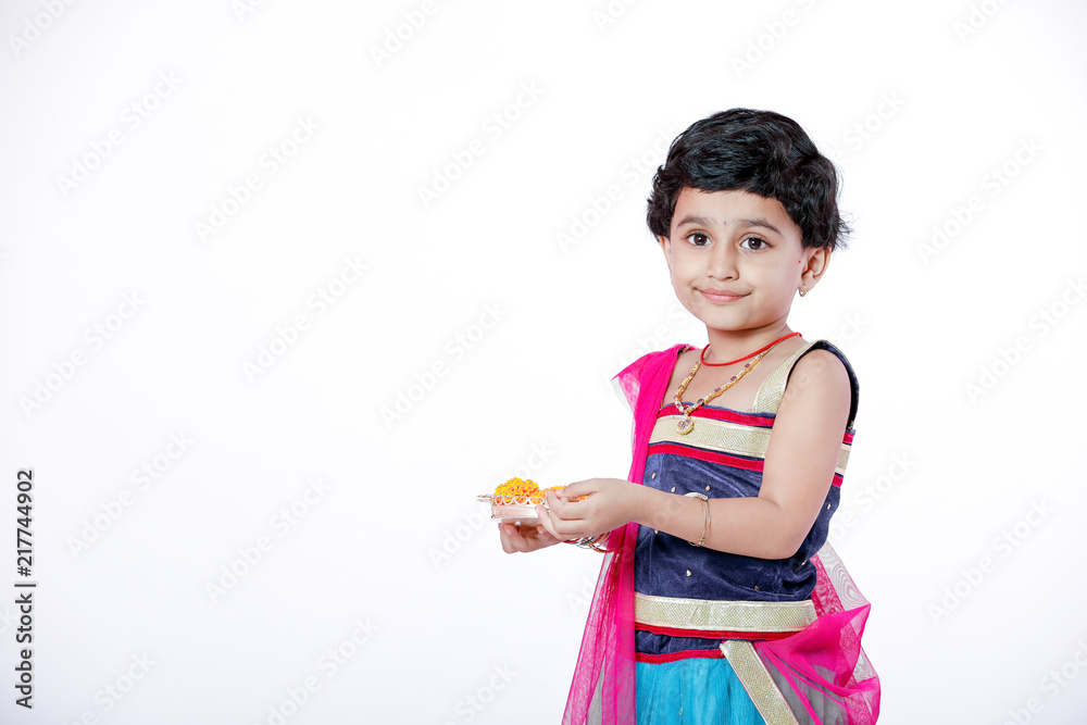 Little Indian girl child with lord ganesha and praying , Indian ganesh festival Little Indian girl child with lord ganesha and praying , Indian ganesh festival