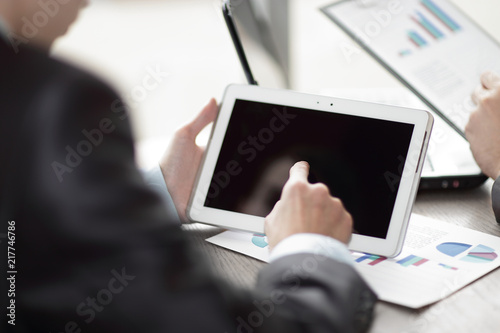 close up.businessman clicks on the screen of a digital tablet