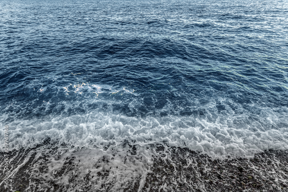 The sea surf. Uneasy waves of the sea shore. The sea surf. Uneasy waves of the sea shore.