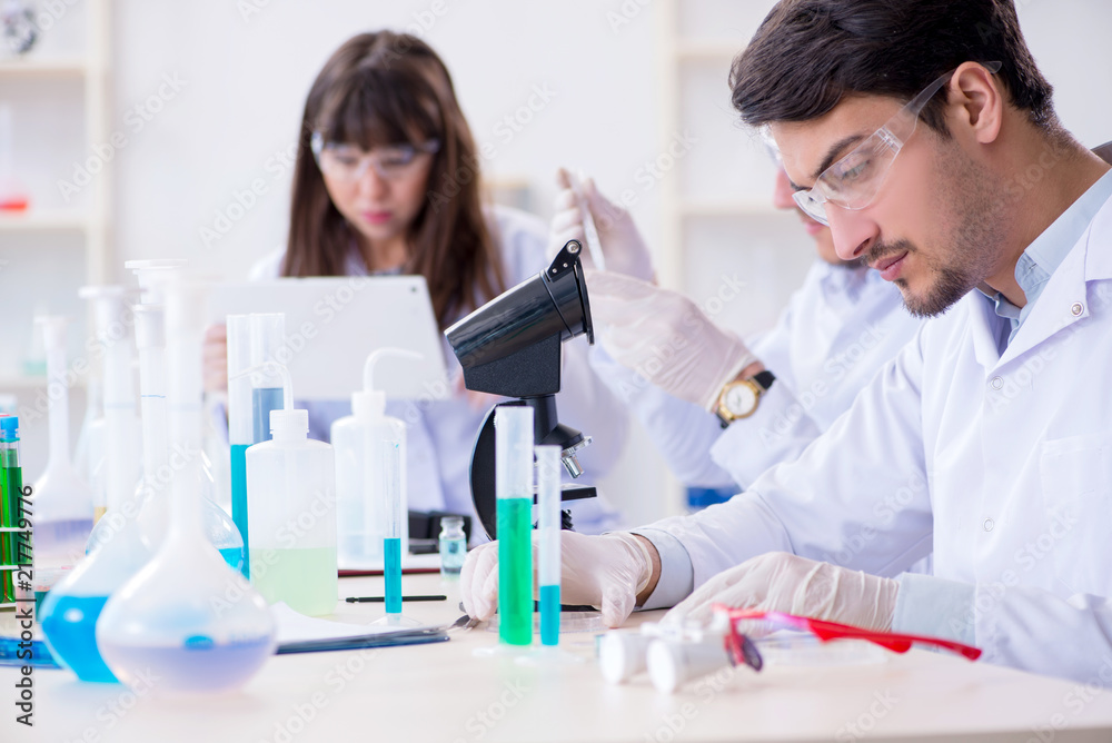 Team of chemists working in the lab