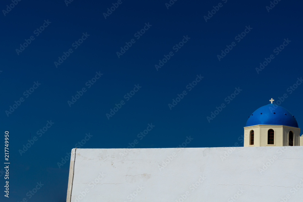 Church with white facade and blue cupola at Oia, Santorini, Greece Church with white facade and blue cupola at Oia, Santorini, Greece