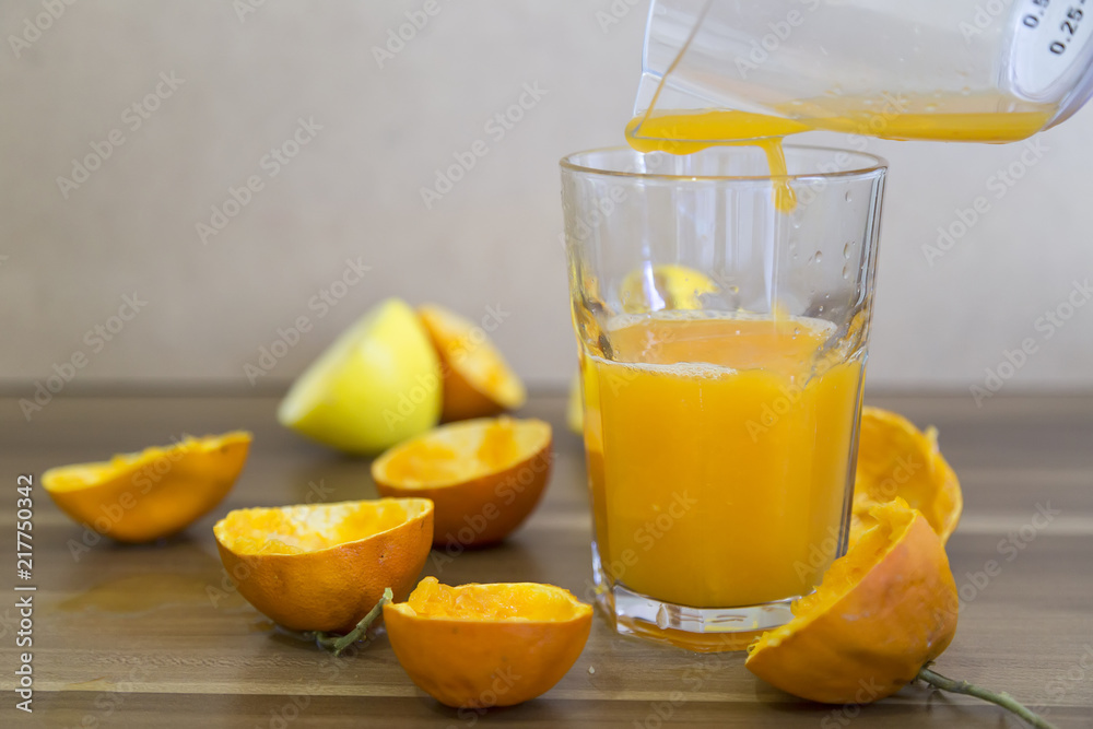 Fresh orange juice in glasses.orange and lemon are a vitamin C store. Drinking natural fruit juice for healthy living. Fresh orange juice in glasses.orange and lemon are a vitamin C store. Drinking natural fruit juice for healthy living.