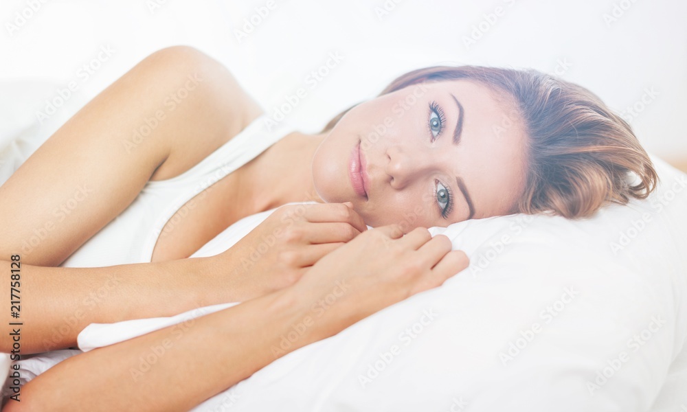 Young woman wakeup after sleeping on the Young woman wakeup after sleeping on the