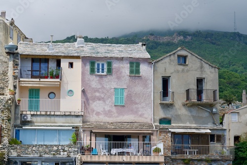 old houses under a grey cloudscape