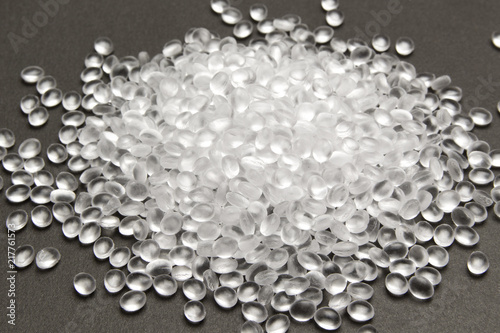 Transparent Polyethylene granules on dark .HDPE Plastic pellets.  Plastic Raw material . IDPE. photo