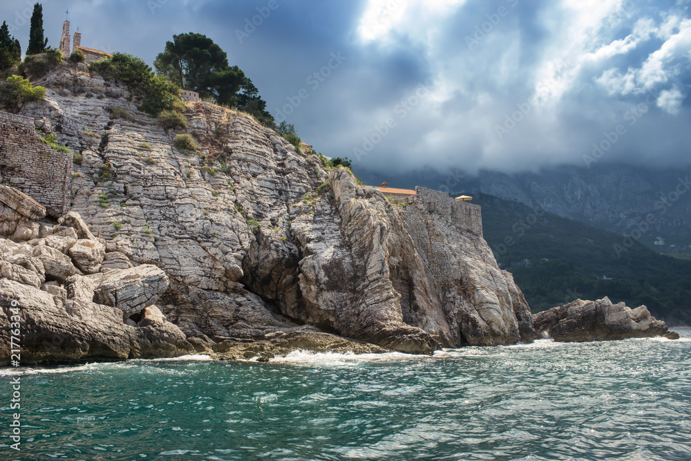 ancient architecture on rocky shores of the turquoise Adriatic S