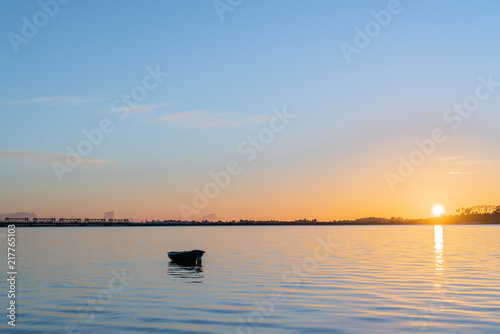Tauranga Harbour sunrise  glow across water at dawn. © Brian Scantlebury