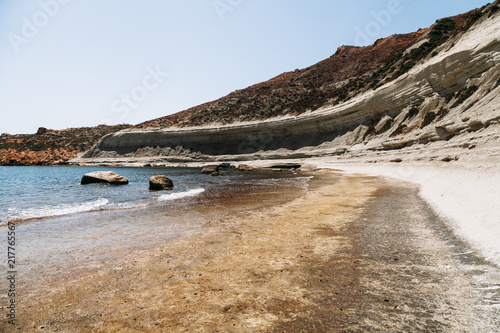 lonely rock beach near marsalforn malta photo