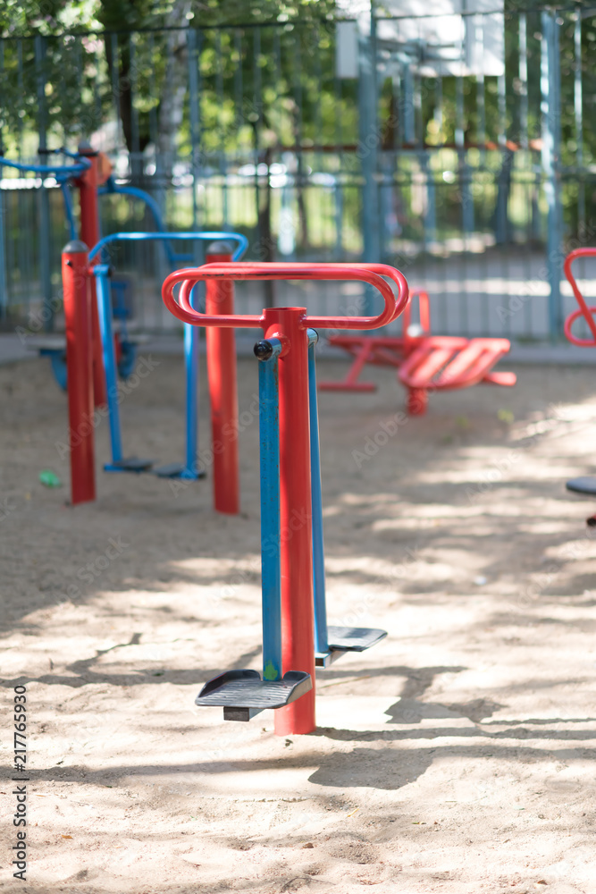 Exercise equipment in a public park in a sunny day Exercise equipment in a public park in a sunny day