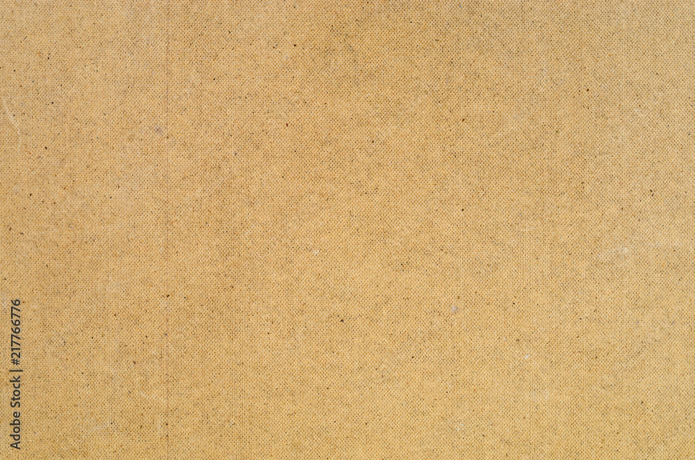 Wooden fiberboard texture. Rear side of the material with regular pattern of embossing. Close-up abstract background of construction material. Wooden fiberboard texture. Rear side of the material with regular pattern of embossing. Close-up abstract background of construction material.