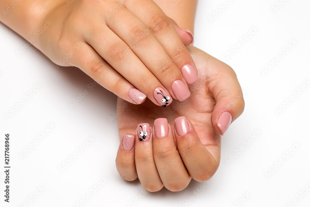 beige pink manicure with sequins and an ant on square short nails
