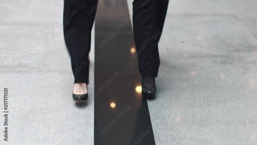 female legs close-up. business women walking through an office building female legs close-up. business women walking through an office building