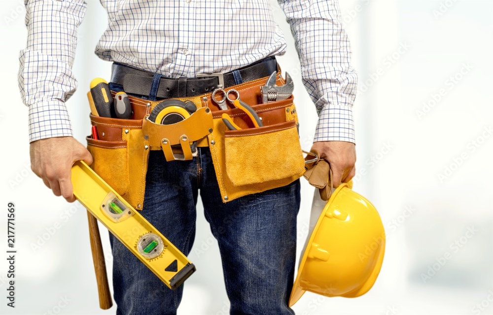 Worker with a tool belt Worker with a tool belt