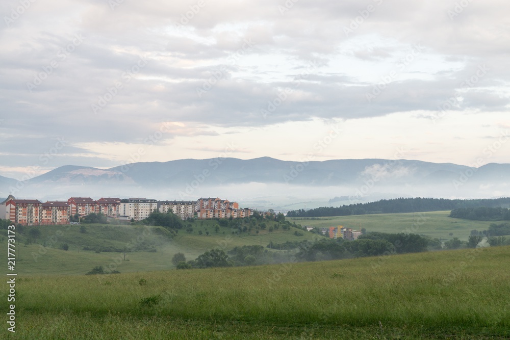 Obraz premium Sunrise and sunset over the hills and town. Slovakia