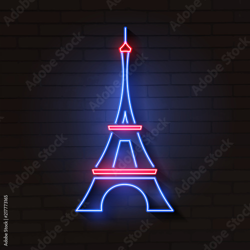 Eiffel tower in neon light on brick