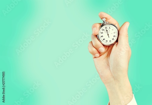 Fototapeta Naklejka Na Ścianę i Meble -  Close-up Stopwatch in Human Hand, Timer