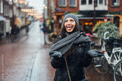 Photography girl in the street in the rain