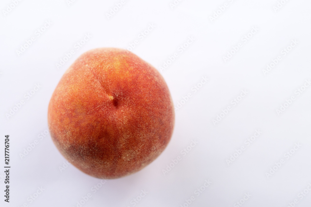 Juicy delicious ripe peach, on a light background. Juicy delicious ripe peach, on a light background.