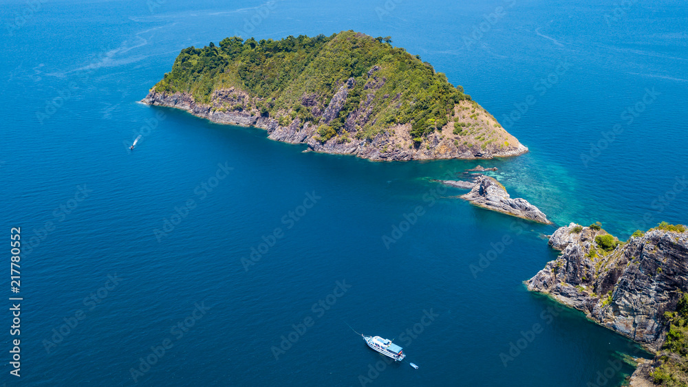 Aerial drone view of a beautiful remote tropical island surrounded by coral reef (Mergui Archipelago, Myanmar)