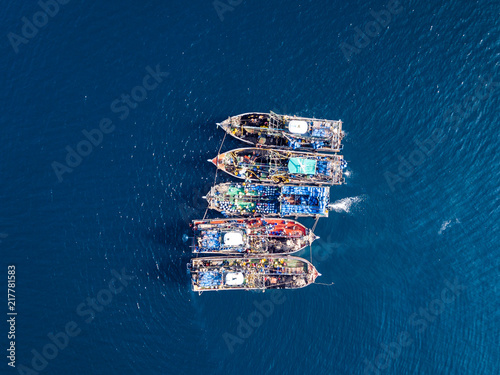 Photography Aerial view of a large number of fishing trawlers operating together illegally i