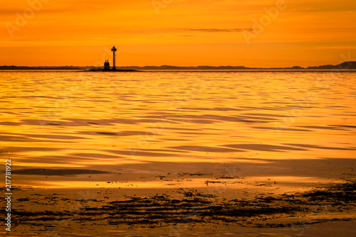 Yellow sunset along the coastline  © Inger