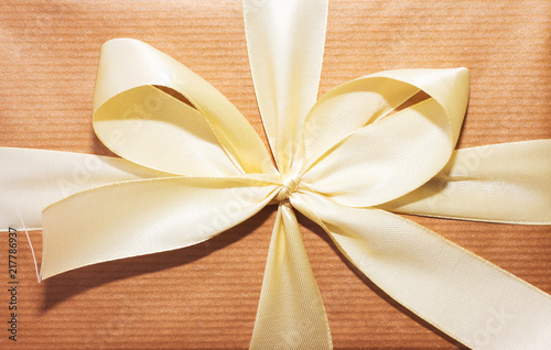 gift box, yellow ribbon and orange wrap paper