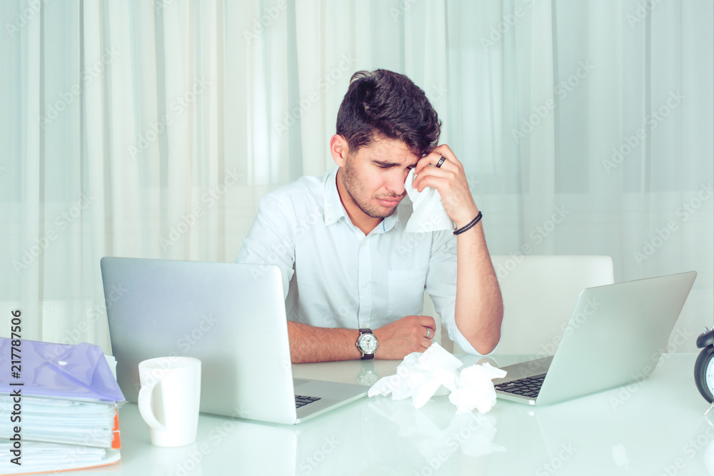 Crying man in office. Crying man in office.