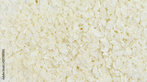 flattened rice flakes as background.