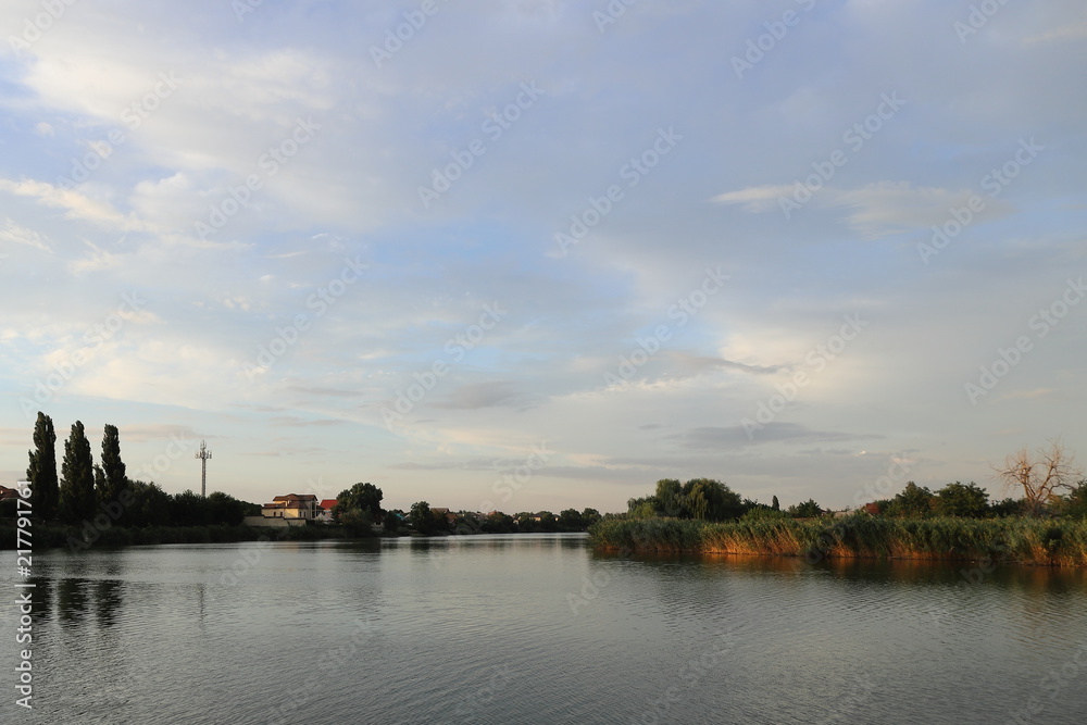 blue sky with white clouds over the river Bank
