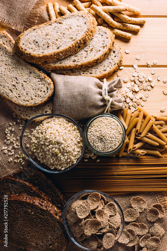 Wooden table full of fiber-rich wholegrain foods, perfect for a balanced diet