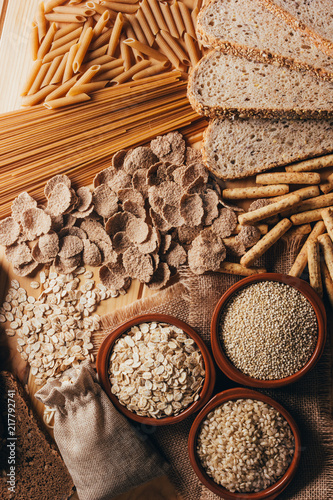 Wooden table full of fiber-rich wholegrain foods, perfect for a balanced diet