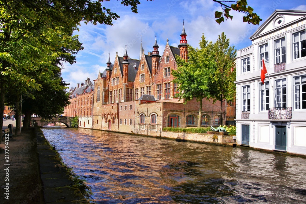 Medieval buildings lining the picturesque canals of Bruges, Belgium