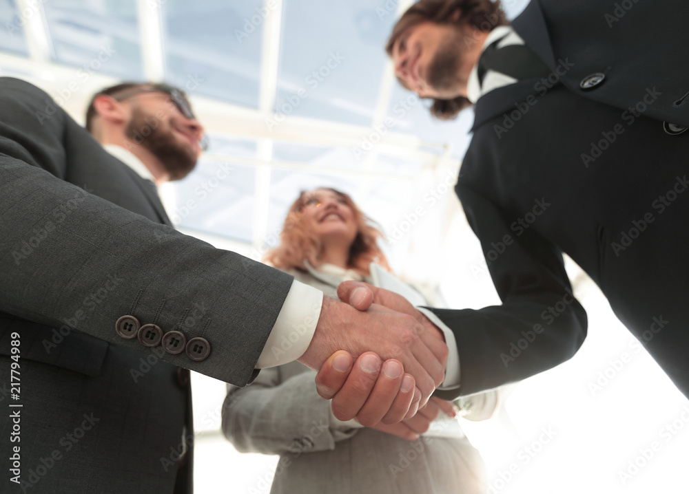 Photo of handshake of two happy businessmen