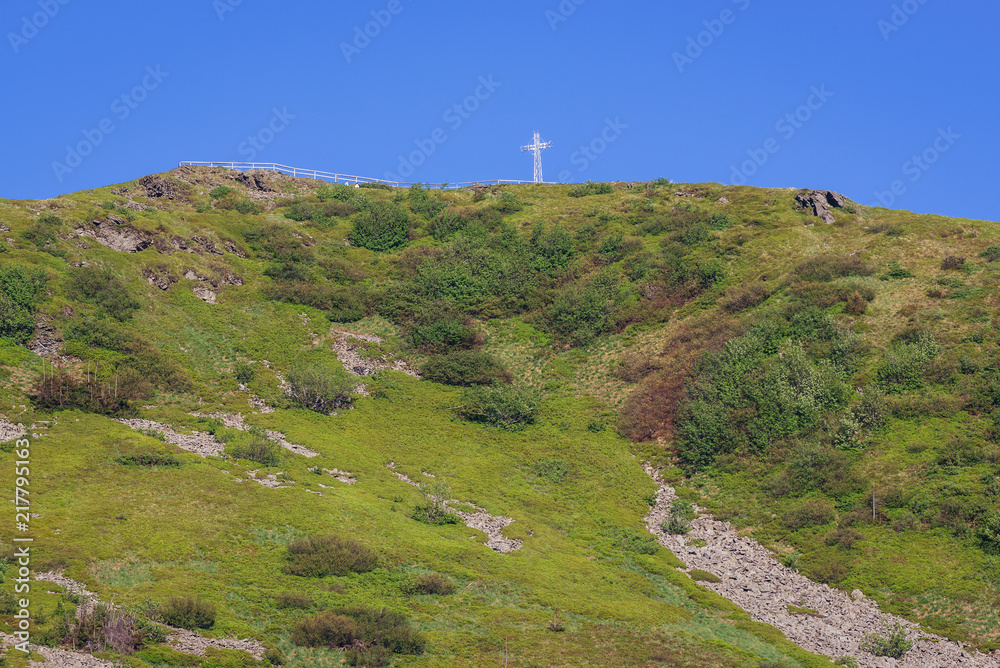 Fototapeta premium Catholic cross on peak of Tarnica Mountain in Bieszczady National Park, Subcarpathian Voivodeship of Poland