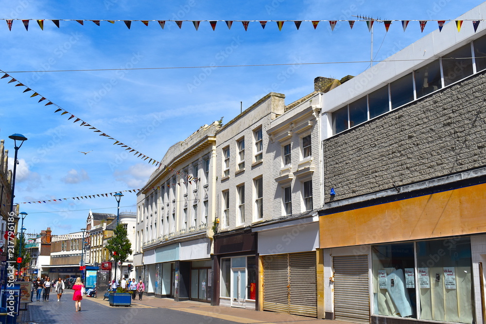 High street with shops and buildings in traditional style. The lively coastal town center of Dover, Kent county, England 
