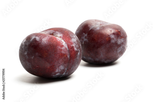 red plum fruit isolated on white
