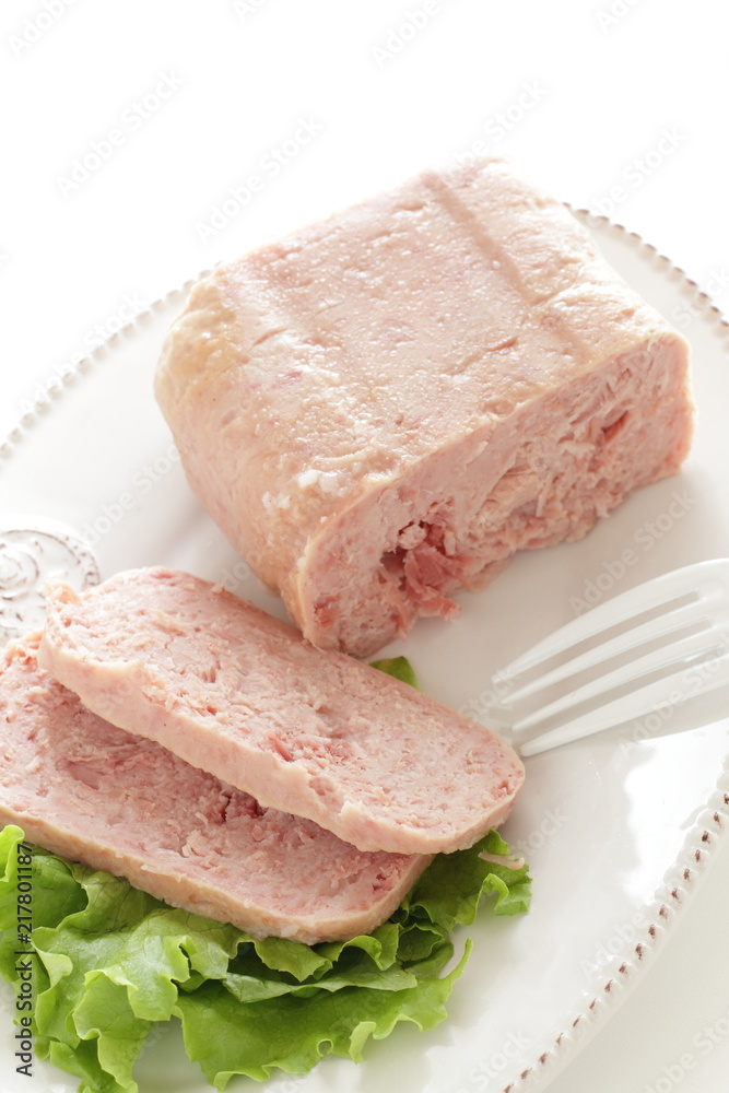 Canned food, luncheon meat on wooden plate Canned food, luncheon meat on wooden plate