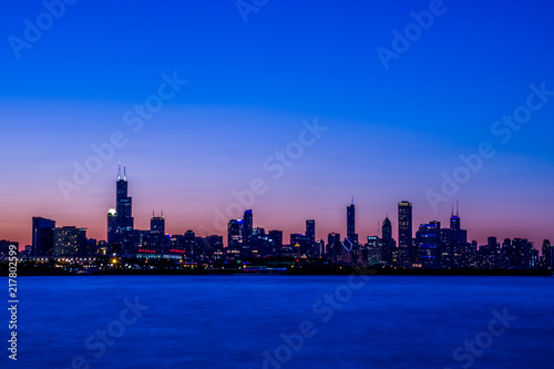 city  skyline  water  urban  chicago  cityscape  downtown  panorama  night  architecture  buildings  sky  building  skyscraper  blue  travel  sunset  view  river  tower  lake  business 