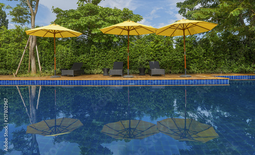 Pool bed with yellow umbrella beside swimming pool for relax